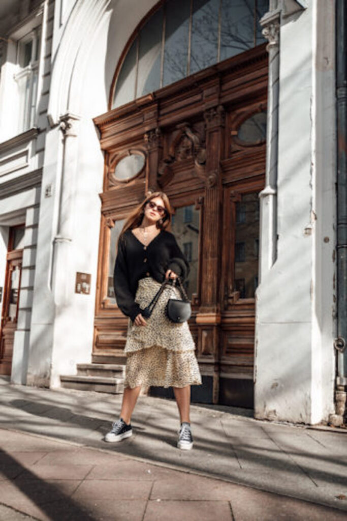 Outfit 1: Thin sweater combined with midi skirt and high heels